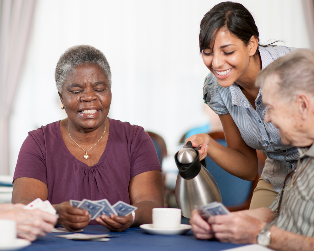 Caregiver looking through a memory book with a client