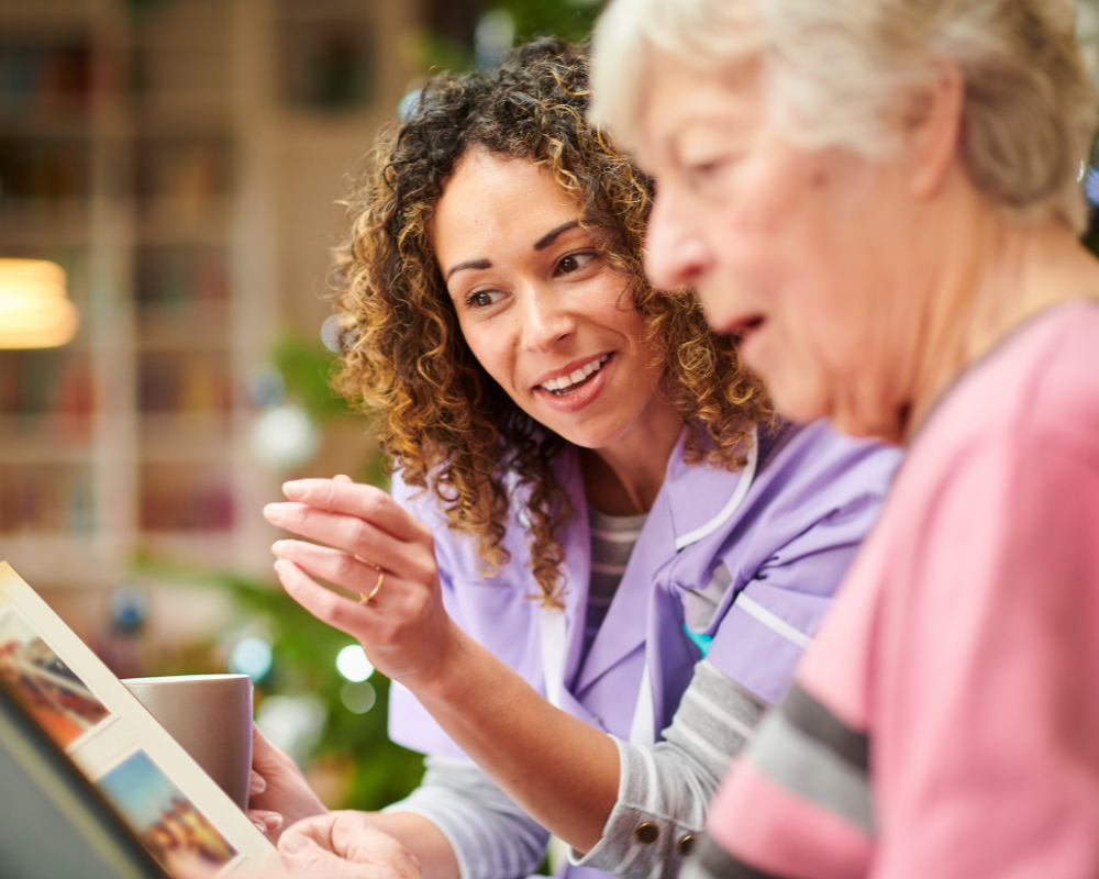 Caregiver doing a cognitive activity with a memory-care client