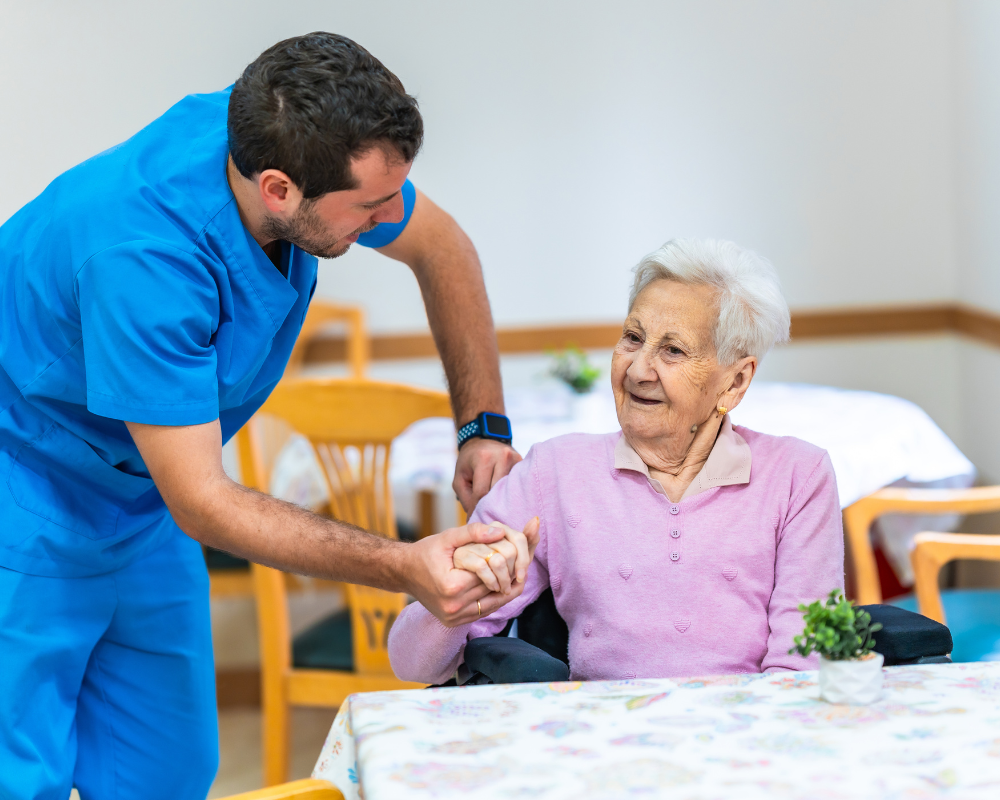 Caregiver helping a senior with daily personal care at home