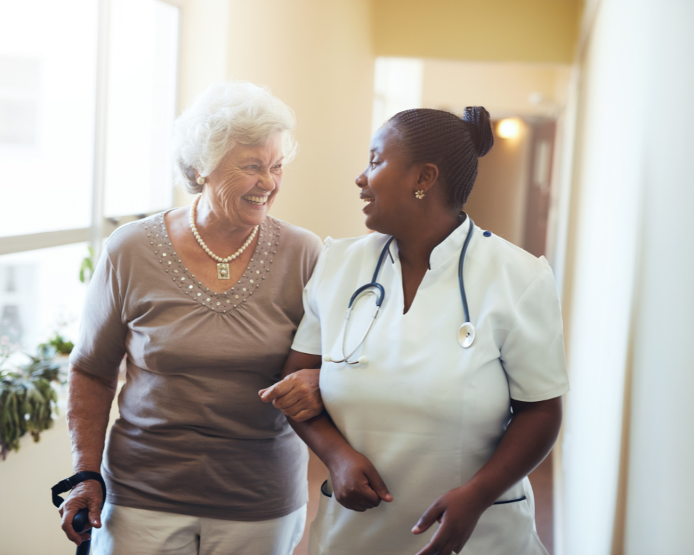 Caregiver supporting a client during post-surgery recovery